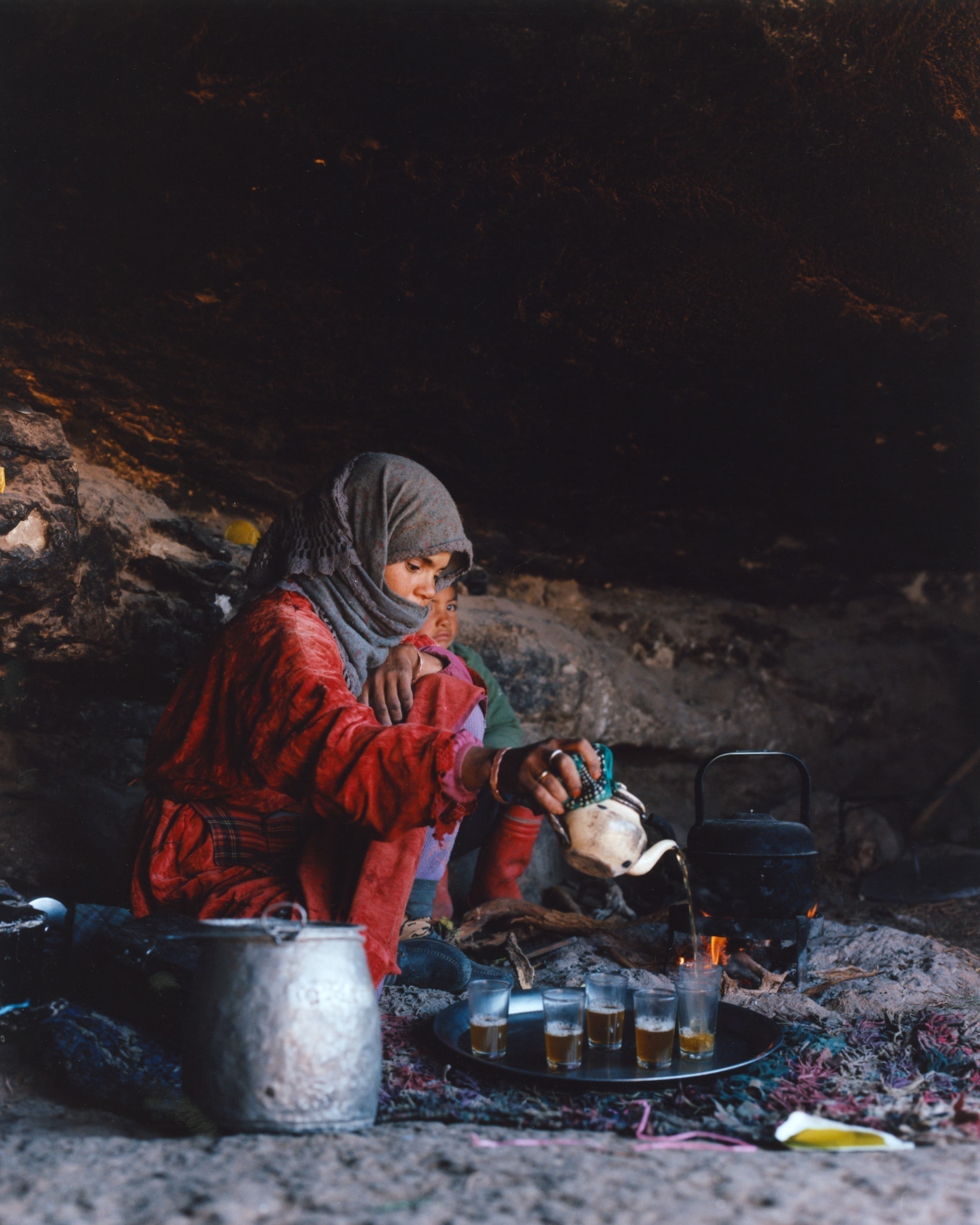 woman pouring tea outdoors