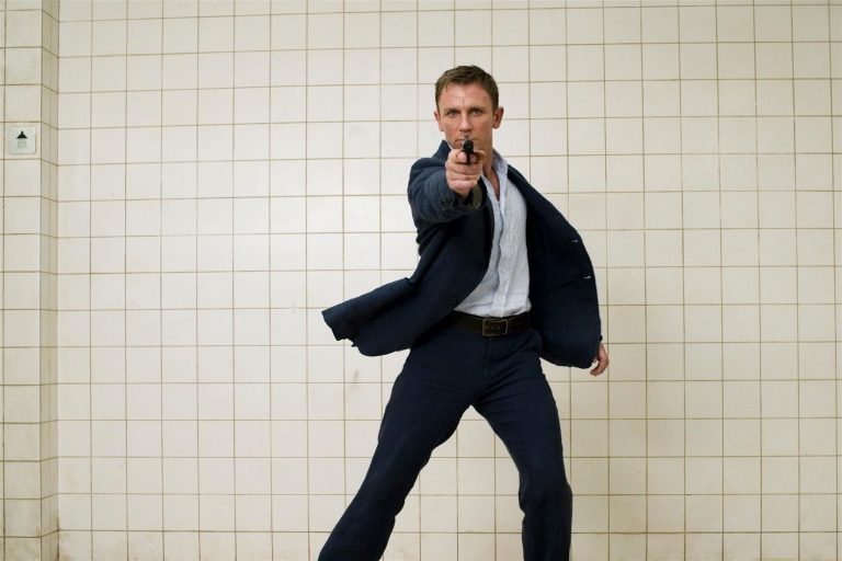 daniel craig as bond shooting the camera