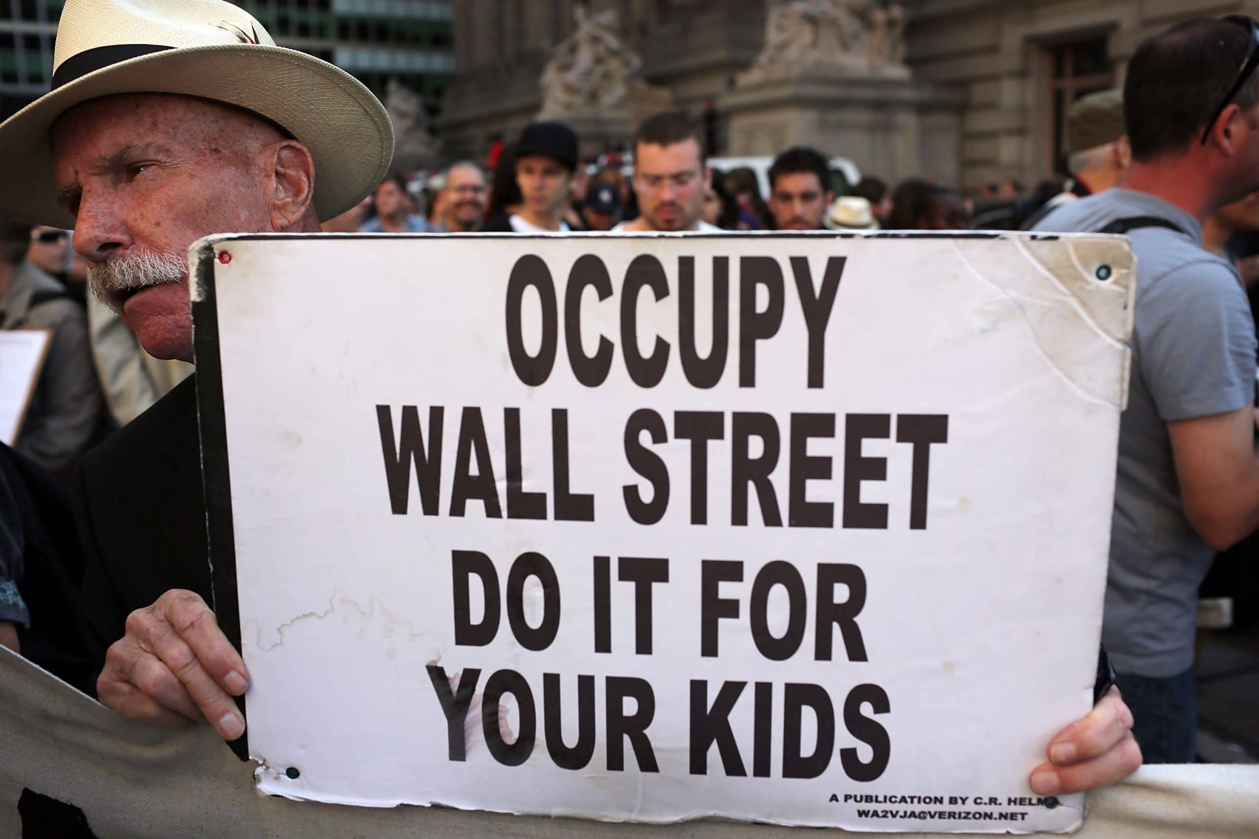 Banner reads "Occupy Wall Street, Do It For Your Kids"