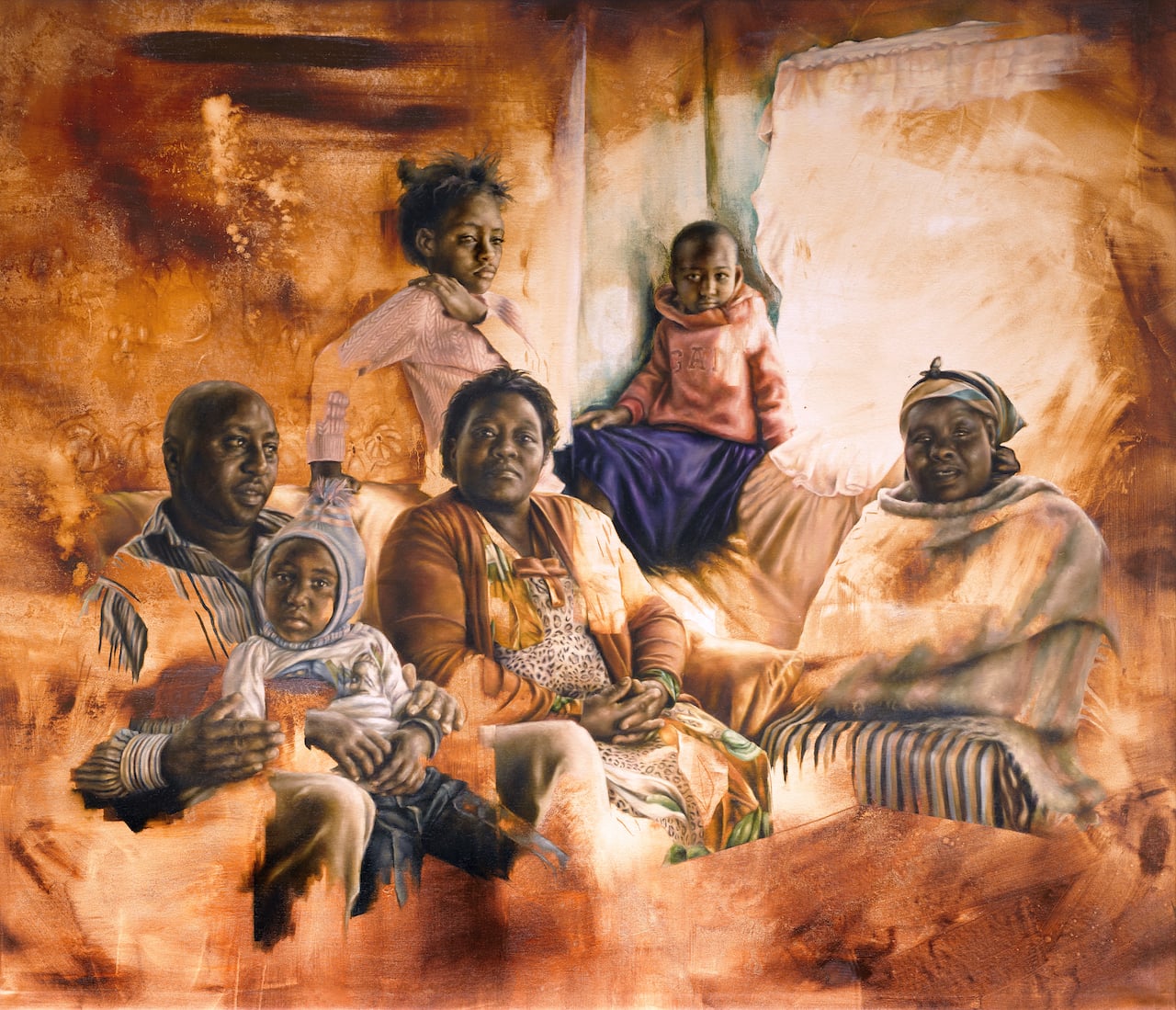 Daniel, a farmer from Lewa, sitting with his three daughters, his wife, and his mother in laugh.