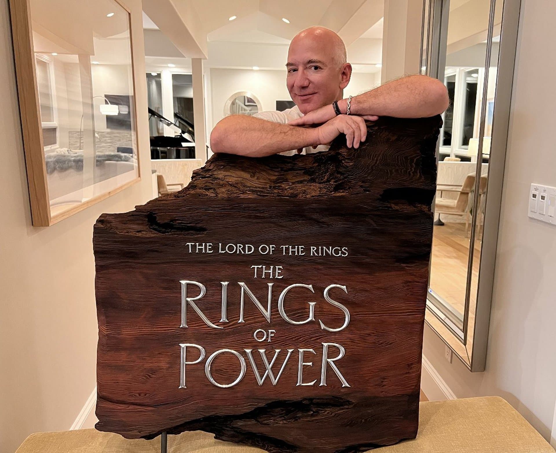 Jeff Bezos posing with The Lord Of The Rings logo