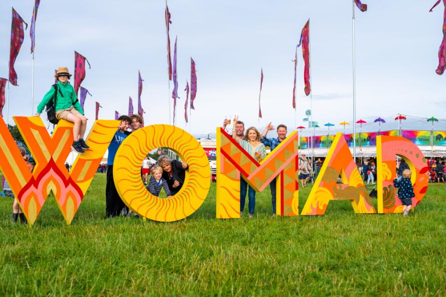 Revelers of all ages enjoying their weekend at WOMAD, which will see over 150 artists perform from over 50 countries. Credit - RyleyMorton (1) (1)