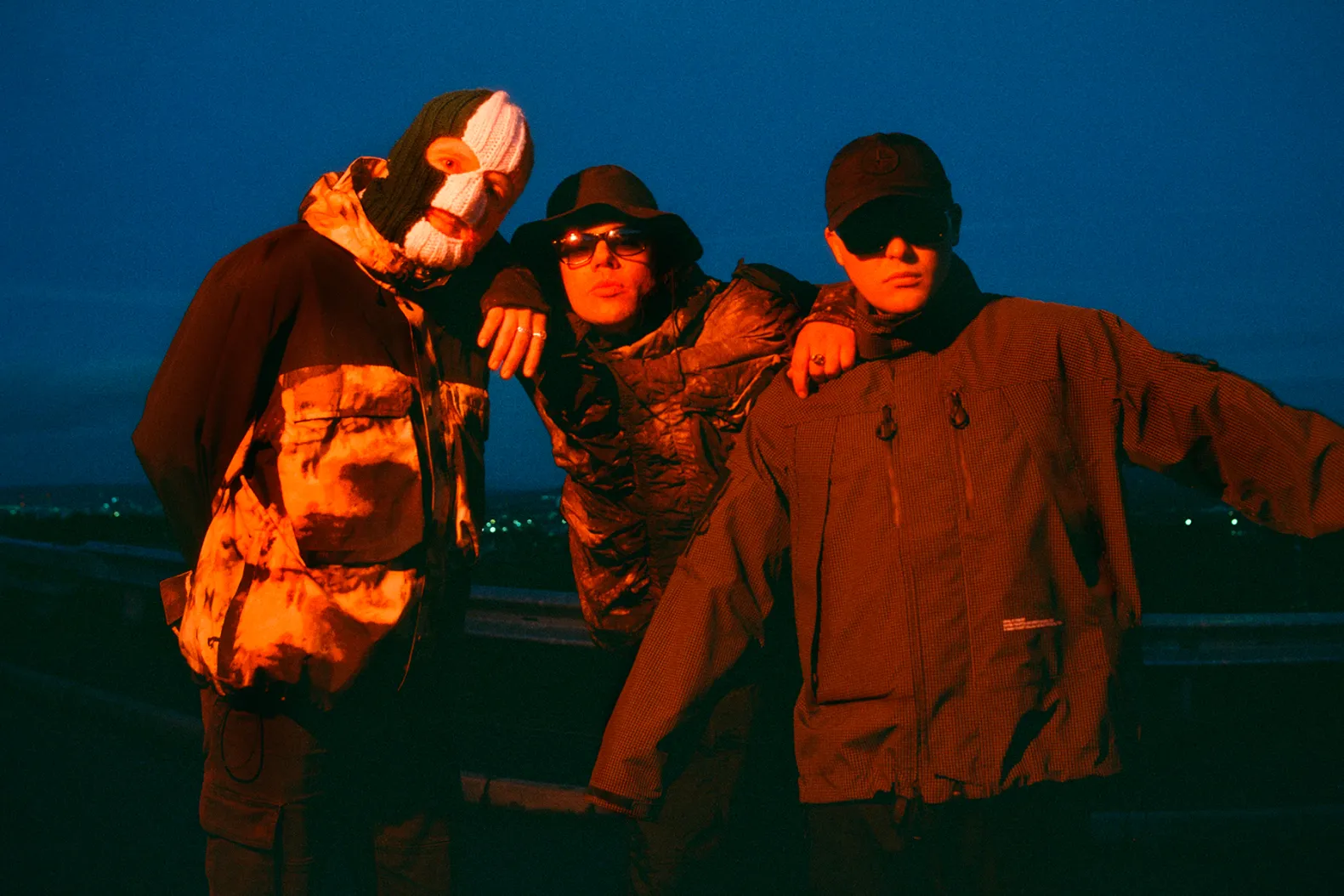 Kneecap press photo 2026, featuring Mo Chara, Móglaí Bap and DJ Próvaí