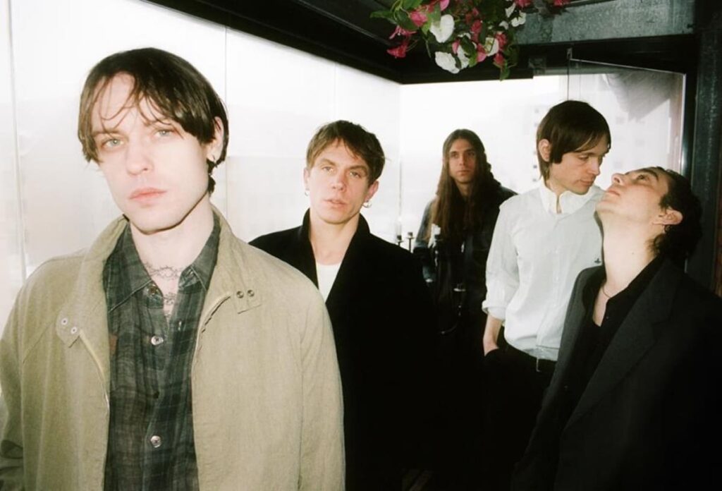 Iceage press photo 2026, featuring Elias Rønnenfelt, Johan Suurballe Wieth, Dan Kjær Nielsen, Casper Morilla Fernandez and Jakob Tvilling Pless